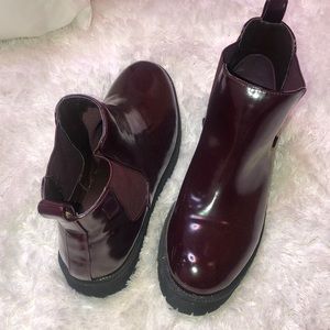 Burgundy ankle boots.
